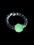  Silver Toned Ring with Multifaceted Green Focal Beads

Can fit up to a size: 13.5/14